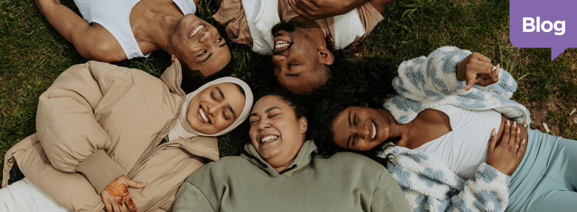 Group of people smiling because of the diversity, equity and inclusion initiatives in the company